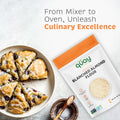 Scones with glaze and berries on a plate next to a bag of Quay Naturals Blanched Almond Flour, promoting culinary excellence.