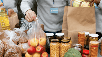 packing food items into paper bags